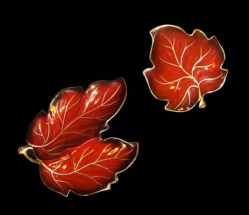 Stylised art deco leaf shapes in strong red with gilt embelishment.
