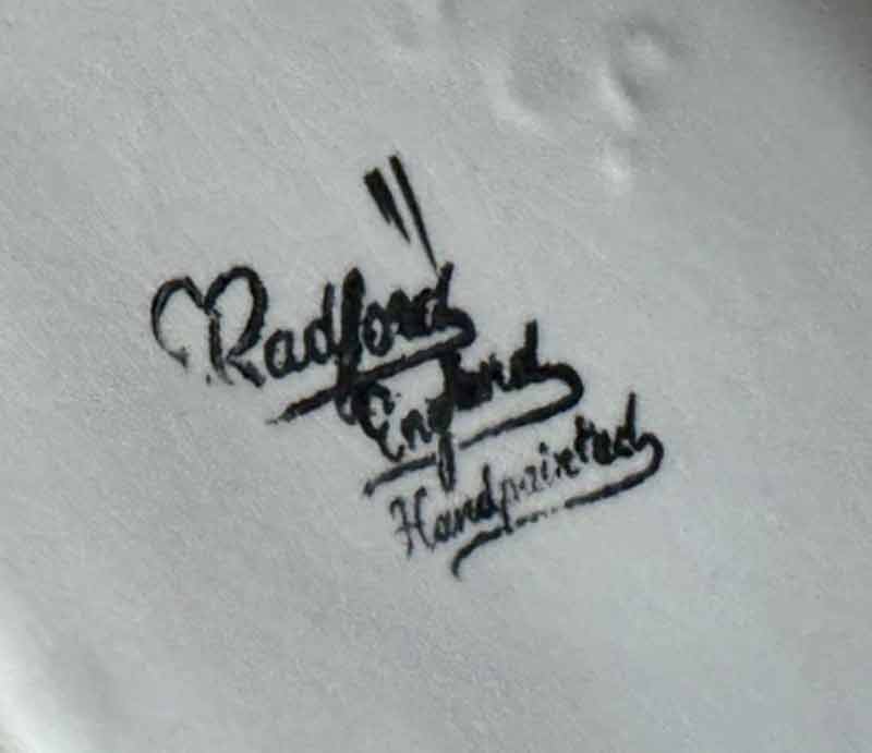 E.Radford mark Stamped on base of jug with 'England and 'Handpained'.