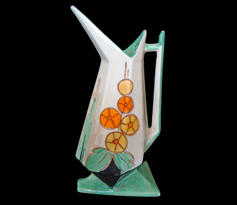 Bird-shaped jug with stylised orange and yellow flowers.